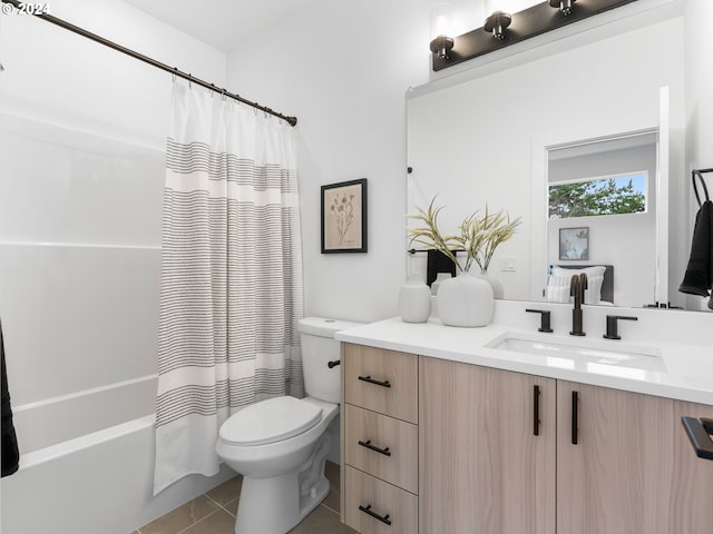 full bathroom with tile patterned flooring, vanity, shower / tub combo, and toilet