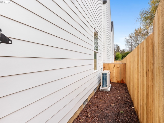 view of side of property with central AC unit