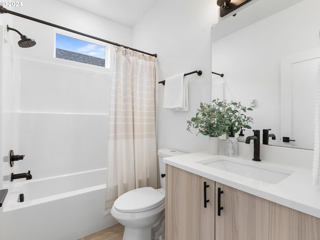 full bathroom with tile patterned floors, shower / bath combo, toilet, and vanity