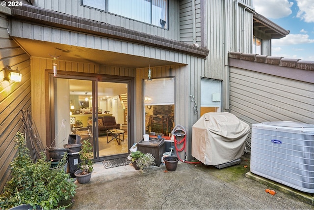 view of patio / terrace featuring central AC unit and a grill