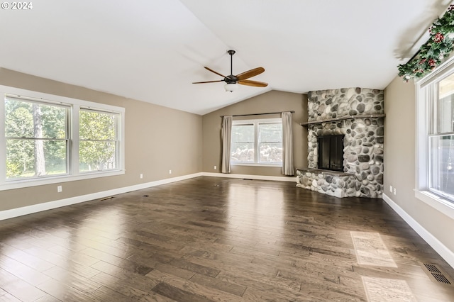 unfurnished living room with ceiling fan, a fireplace, dark wood-type flooring, and lofted ceiling