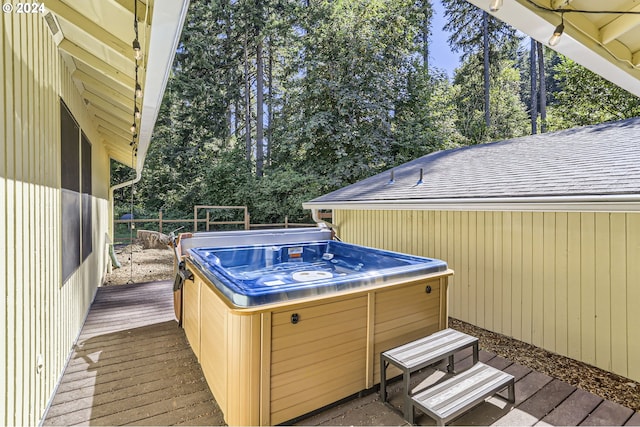 deck featuring a hot tub