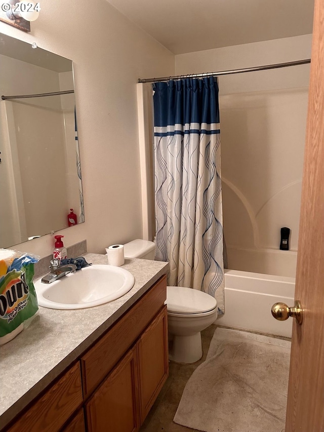 bathroom featuring vanity, toilet, and shower / bathtub combination with curtain