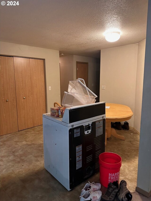misc room with a textured ceiling