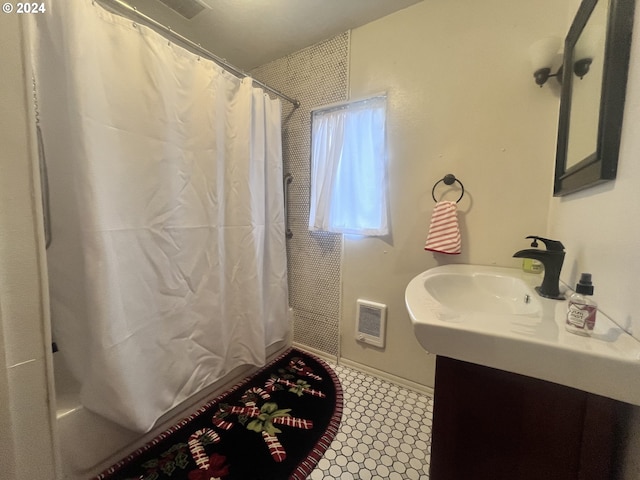 bathroom with vanity and walk in shower