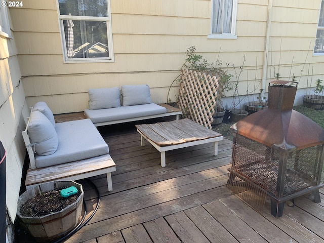 wooden terrace featuring outdoor lounge area