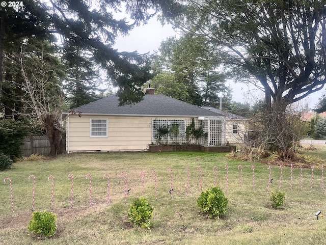 view of home's exterior featuring a yard