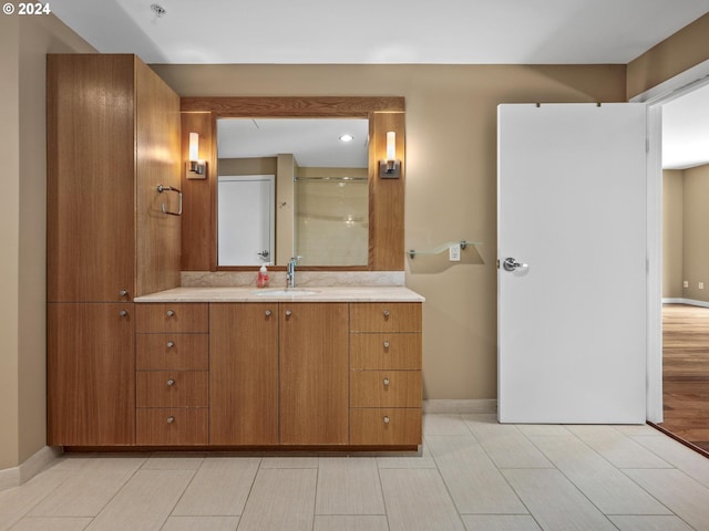 bathroom featuring vanity and hardwood / wood-style floors