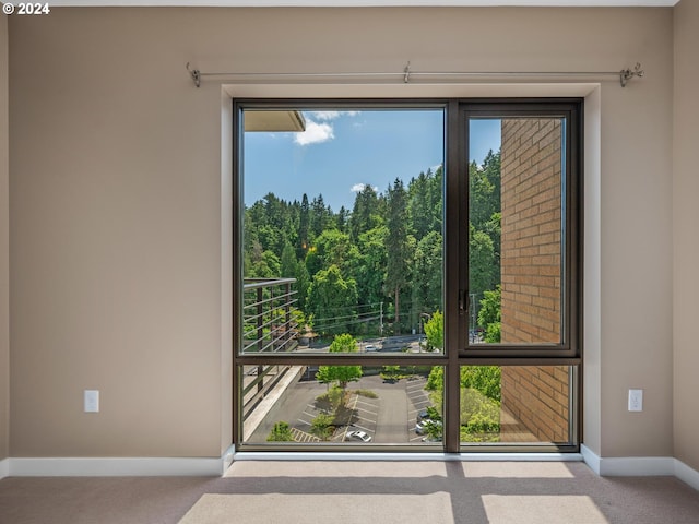 entryway with light colored carpet