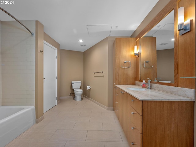 full bathroom with tiled shower / bath, vanity, toilet, and tile patterned floors