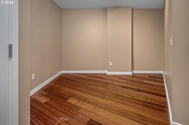 spare room featuring hardwood / wood-style flooring