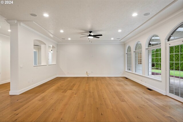 unfurnished room featuring recessed lighting, baseboards, light wood-style flooring, and crown molding