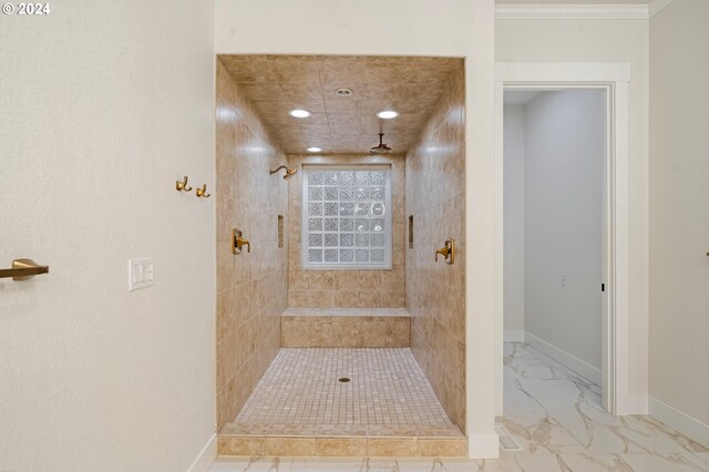 full bathroom with recessed lighting, marble finish floor, tiled shower, and baseboards