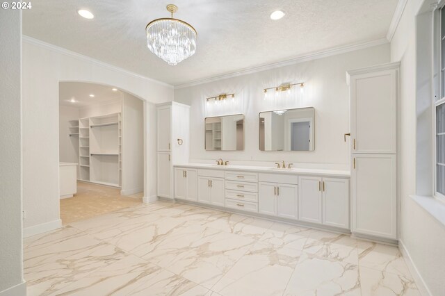 full bath featuring baseboards, a textured ceiling, marble finish floor, and ornamental molding