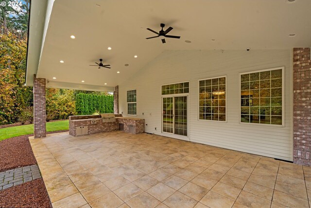 view of patio with area for grilling and ceiling fan