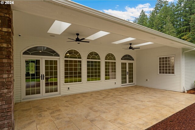 view of patio / terrace with a ceiling fan and french doors