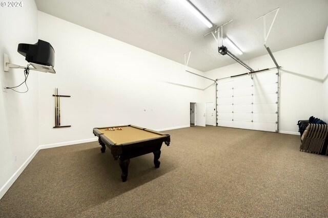 garage featuring a garage door opener and baseboards