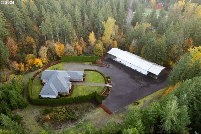 drone / aerial view with a view of trees