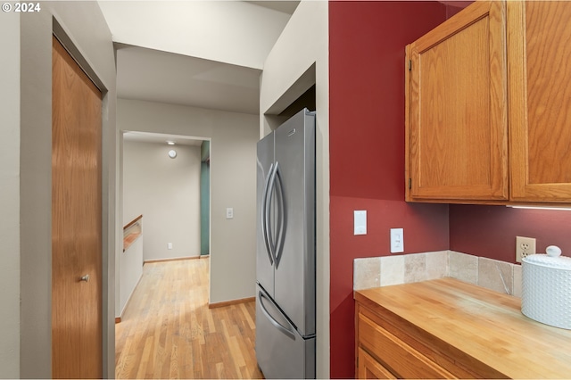 kitchen featuring stainless steel refrigerator and light wood-type flooring