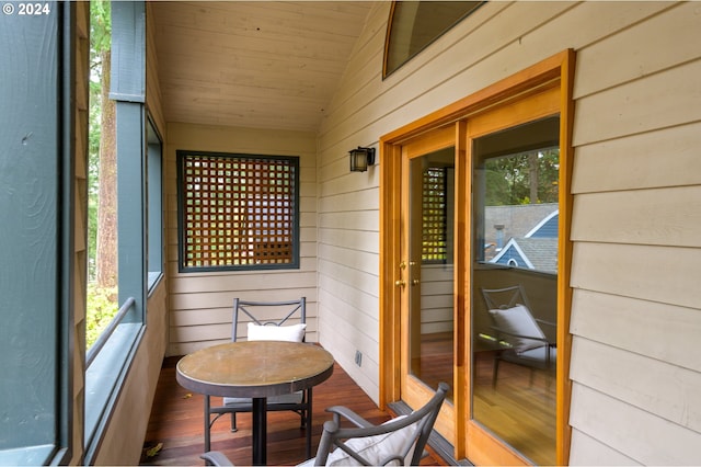 exterior space featuring wood ceiling and vaulted ceiling