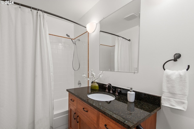 bathroom with vanity and shower / bath combo