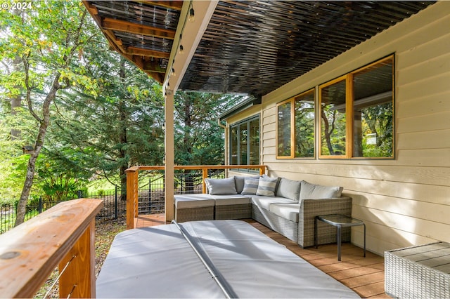 wooden terrace with an outdoor hangout area