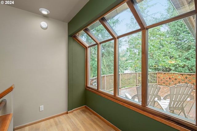 unfurnished sunroom featuring a wealth of natural light