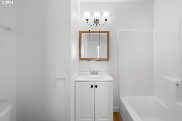 bathroom featuring vanity and toilet