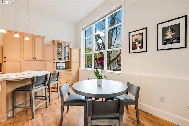 dining area with light wood-type flooring