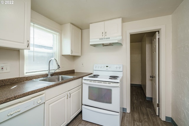 kitchen featuring white cabinetry, white appliances, sink, and dark hardwood / wood-style flooring