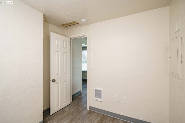 empty room with dark hardwood / wood-style floors