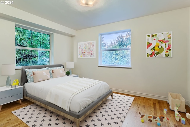 bedroom with hardwood / wood-style floors