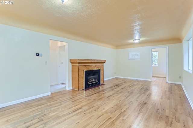 unfurnished living room with light hardwood / wood-style flooring