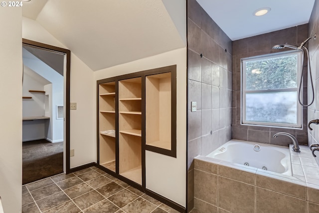 bathroom featuring lofted ceiling, tile patterned floors, and built in features