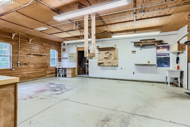 interior space with sink and wooden walls