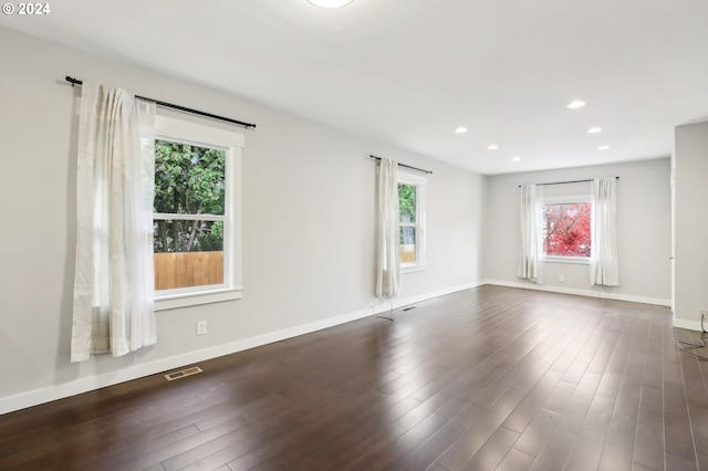 empty room featuring dark hardwood / wood-style floors