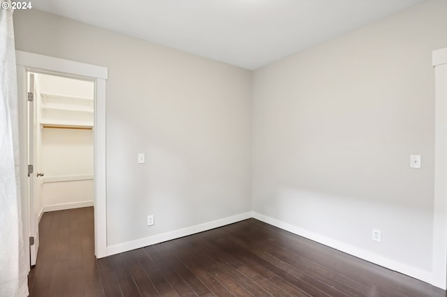 spare room featuring dark hardwood / wood-style flooring