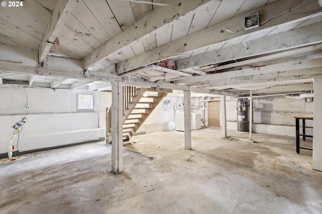 basement featuring washer / dryer and electric water heater