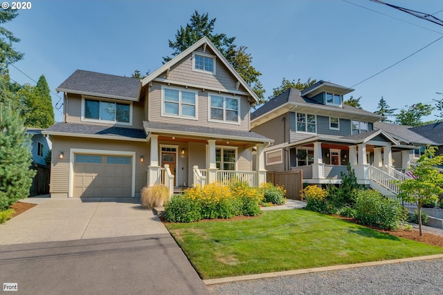 craftsman inspired home with covered porch, an attached garage, and concrete driveway