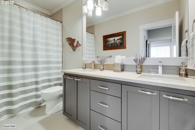 full bath featuring crown molding, toilet, double vanity, and a chandelier