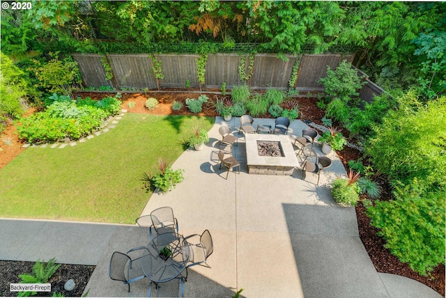 view of patio / terrace featuring an outdoor fire pit