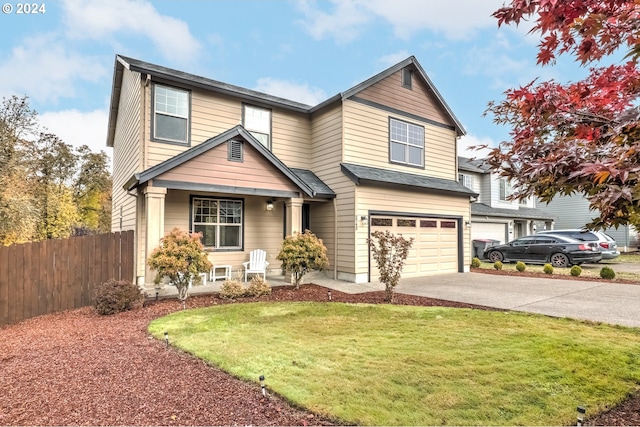 view of front of property featuring a front yard and a garage