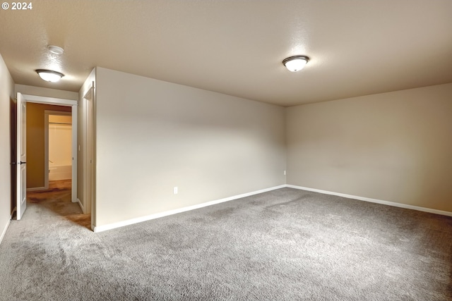 unfurnished room with carpet flooring