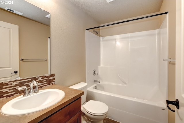 full bathroom with washtub / shower combination, toilet, a textured ceiling, vanity, and decorative backsplash