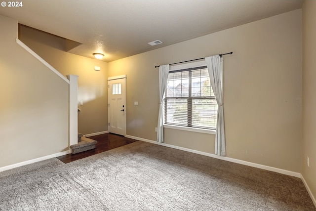 view of carpeted entrance foyer