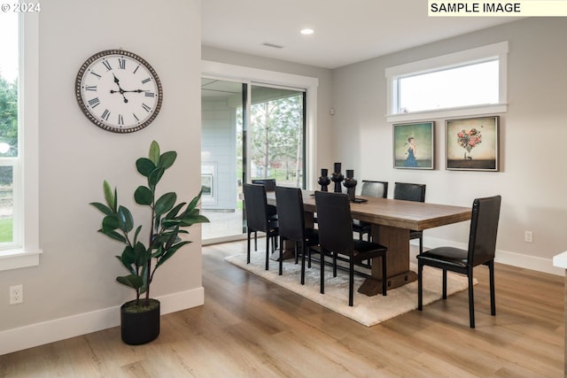 dining area featuring light wood-type flooring