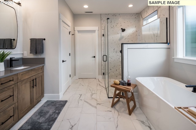 bathroom with tile flooring, a healthy amount of sunlight, vanity, and separate shower and tub