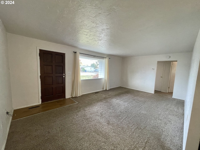 interior space with a textured ceiling