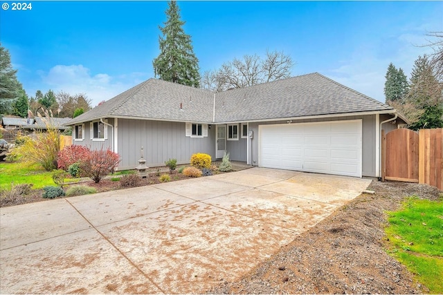 ranch-style house featuring a garage