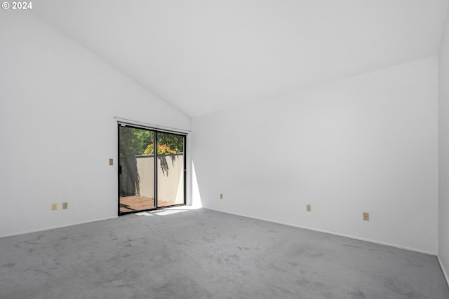 unfurnished room featuring high vaulted ceiling and carpet floors